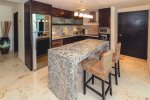 Kitchen with breakfast bar and stainless steel appliances